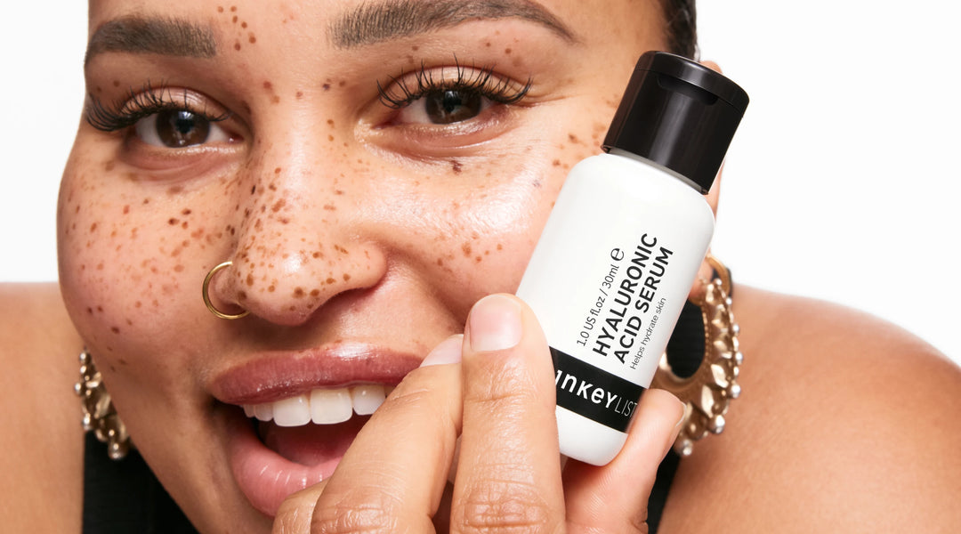 Model holding bottle of Hyaluronic Acid Serum