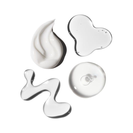 Various textures of white cream on a white background