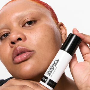 Model holding 15% Vitamin C Serum + EGF