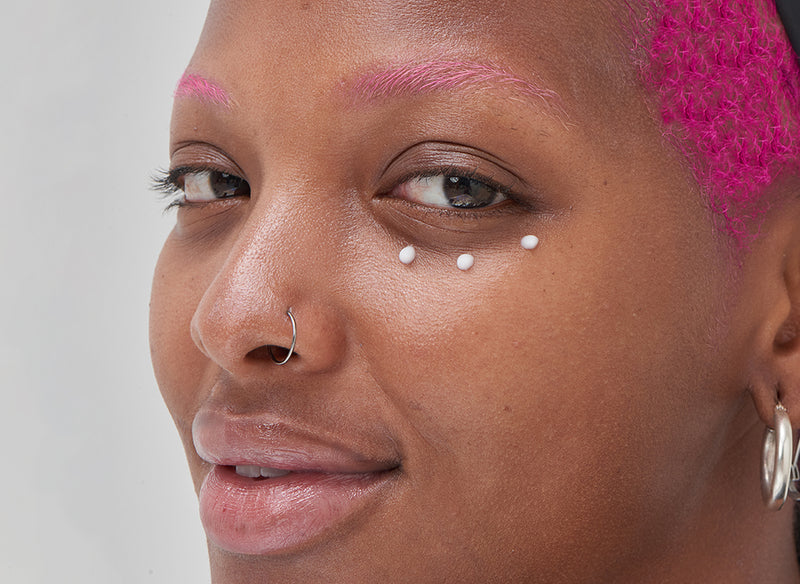 Model with Caffeine Eye Cream under her eyes