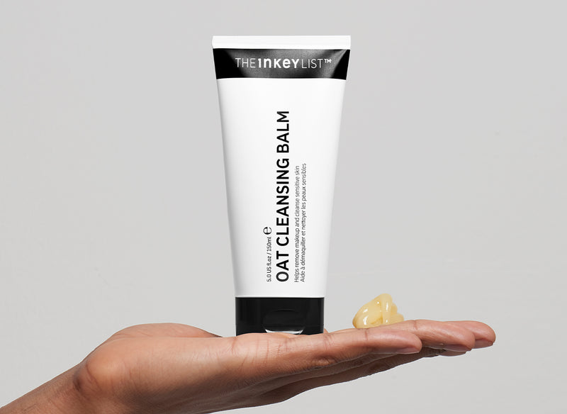 Model holding Oat Cleansing Balm in their hand
