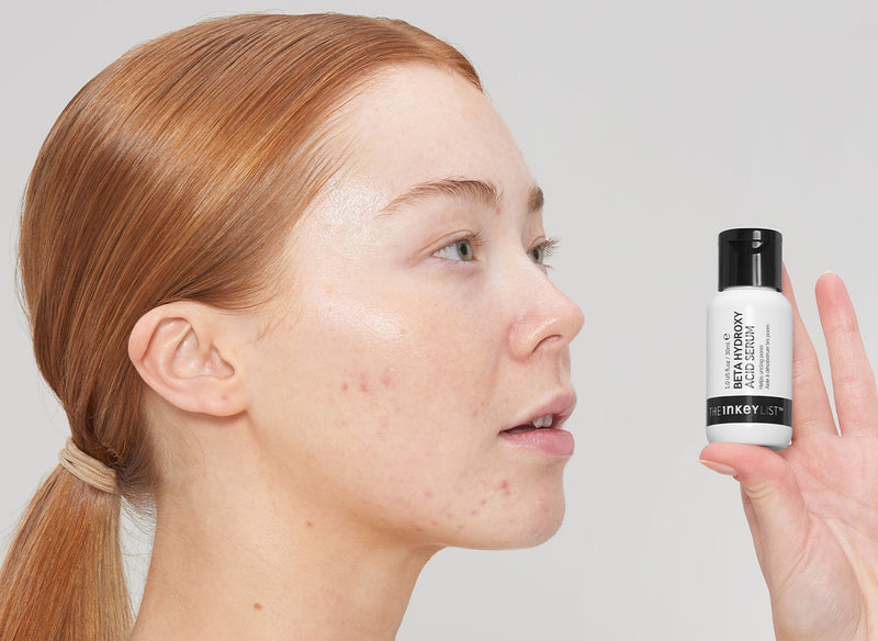 Model holding Beta Hydroxy Acid bottle