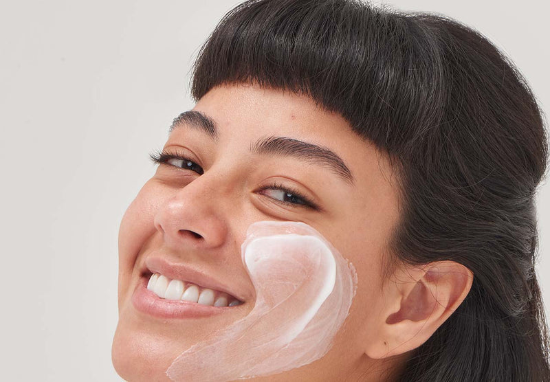 Model with moisturiser on her face