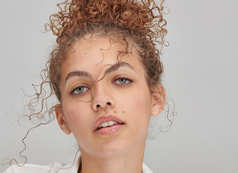 Model with her hair in a bun