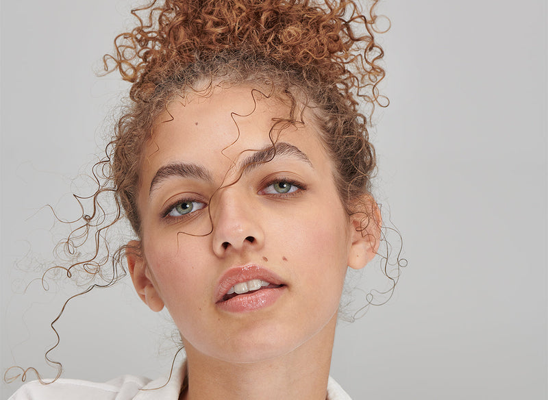 Model with her hair in a bun