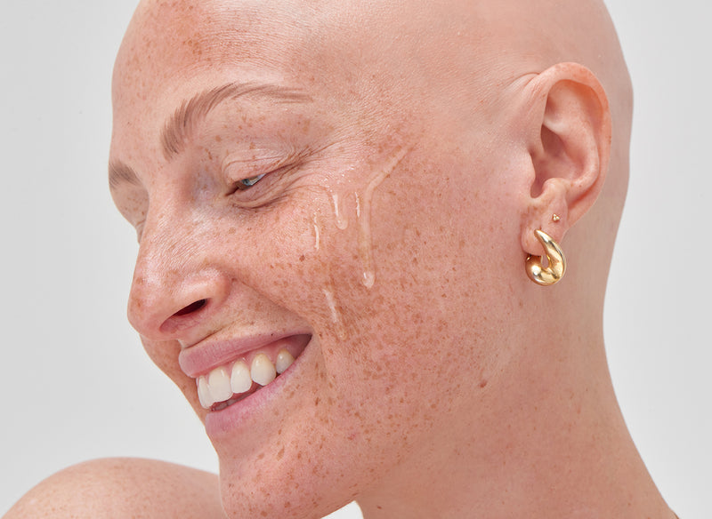 Model with serum on her cheek
