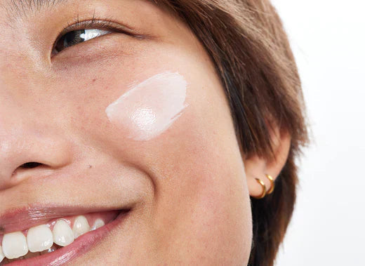 Woman with cream on her face