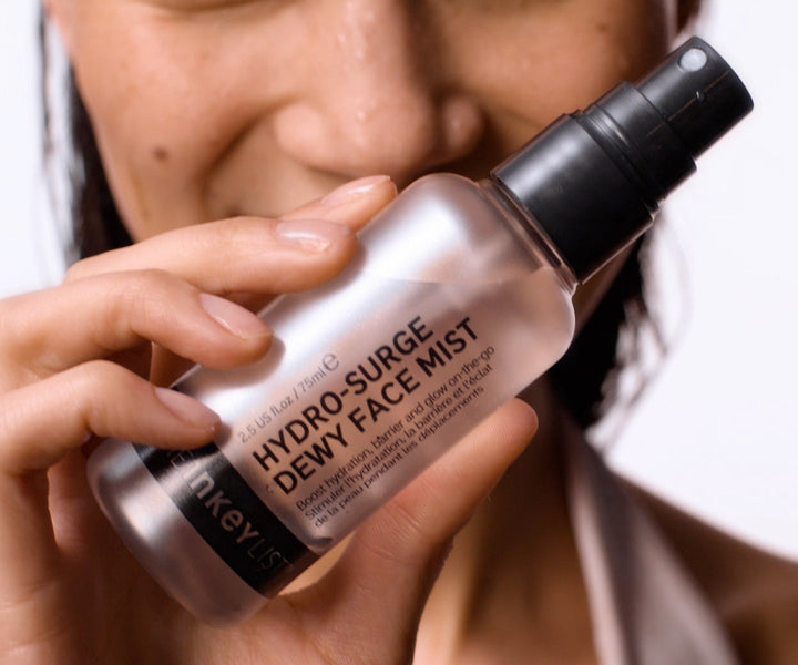 model applying Milky Cleanser and Dewy Face Mist.