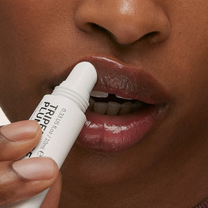 Model applying Berry Tripeptide Lip Balm