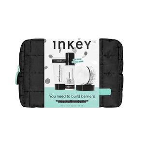Inkey skincare product set in a black pouch on a white background