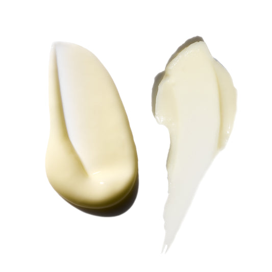 Two swatches of cream on a white background