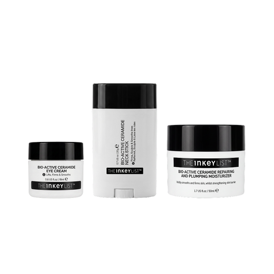 Three skincare products from The Inkey List on a plain white background: a small eye cream jar, a tall cream stick, and a moisturizer jar. The containers are white with black lids and black label bands.