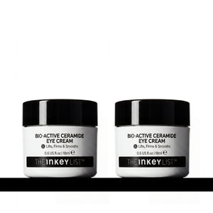 Two white jars of THE INKEY LIST Bio-Active Ceramide Eye Cream with black lids, displayed side-by-side on a white background with a black horizontal line at the bottom.