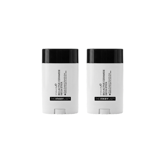 Two white and black stick containers of The Inkey List neck stick, displayed side-by-side on a solid white background.