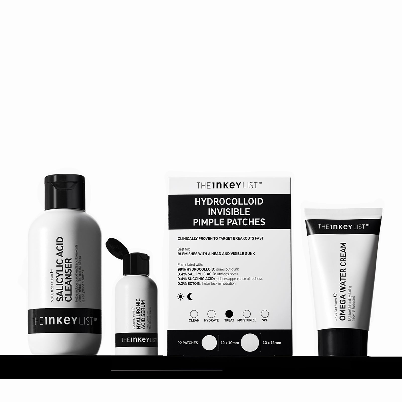 Collection of The Inkey List skincare products including cleanser, cream, and pimple patches on a white background.