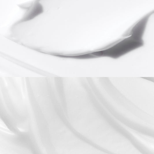 Close-up of a white skincare goop with a soft focus background