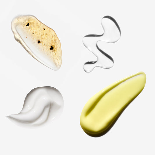 Four different colored cosmetic product swatches on a white background