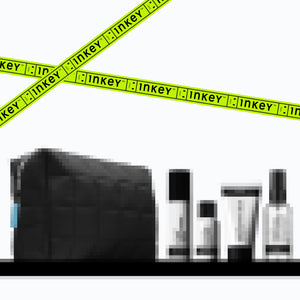 Black makeup bag with Inkey List skincare products on a white background with green tape.