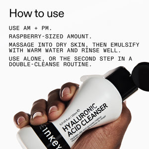 Hand holding a bottle of Hyaluronic Acid Cleanser with usage instructions.