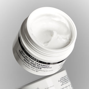 Bio-Active Ceramide Repairing and Plumping Moisturizer tub with lid off to show the texture inside