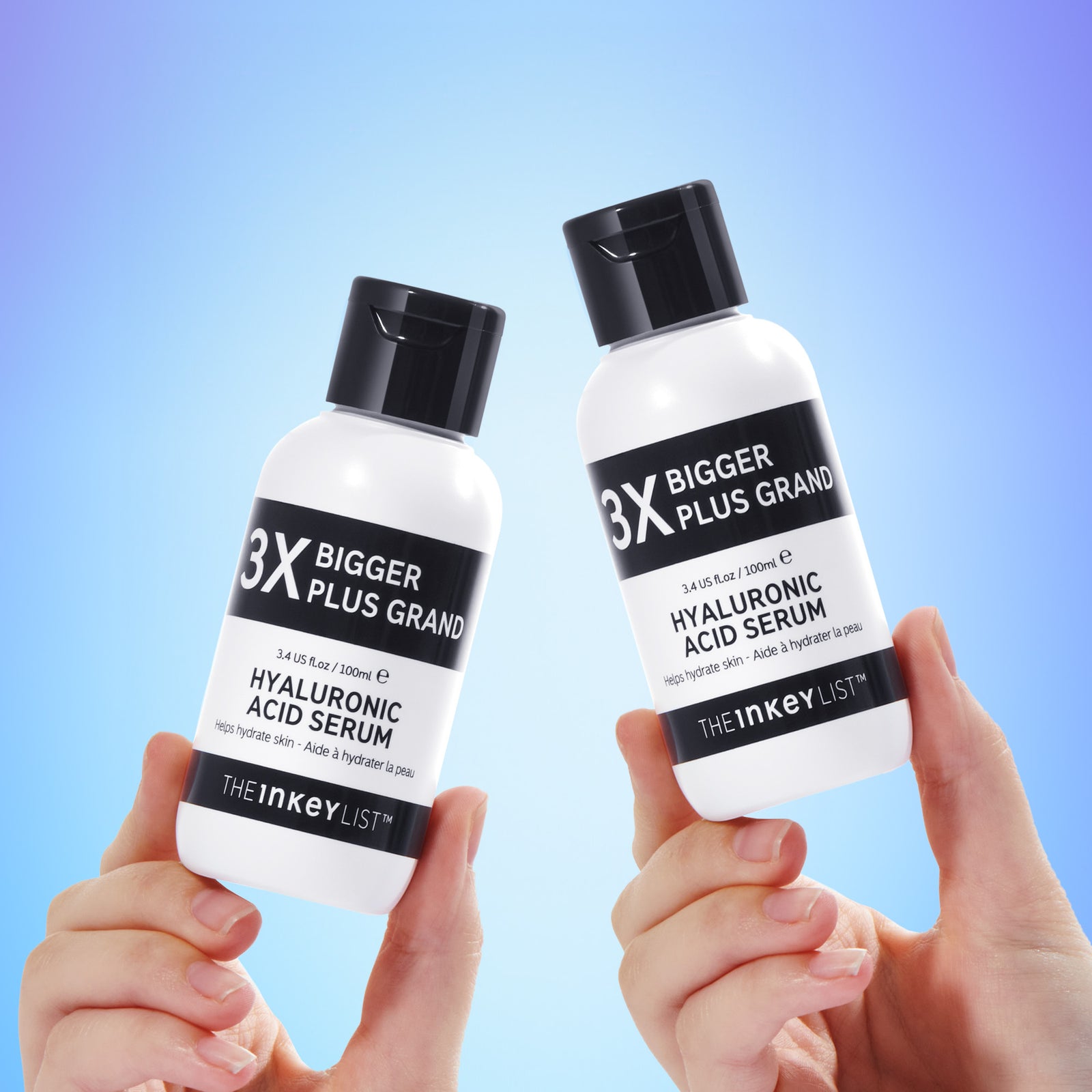 Supersize Hyaluronic Acid Serum Duo light shot with each bottle being held in a pair of hands