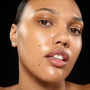 Close-up of a person's face with a black background