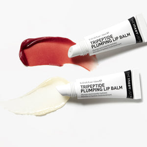 Goop shot of Berry and Clear Tripeptide Lip Balm with product tube