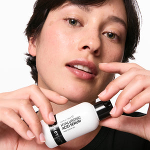 Model holding hyaluronic acid serum