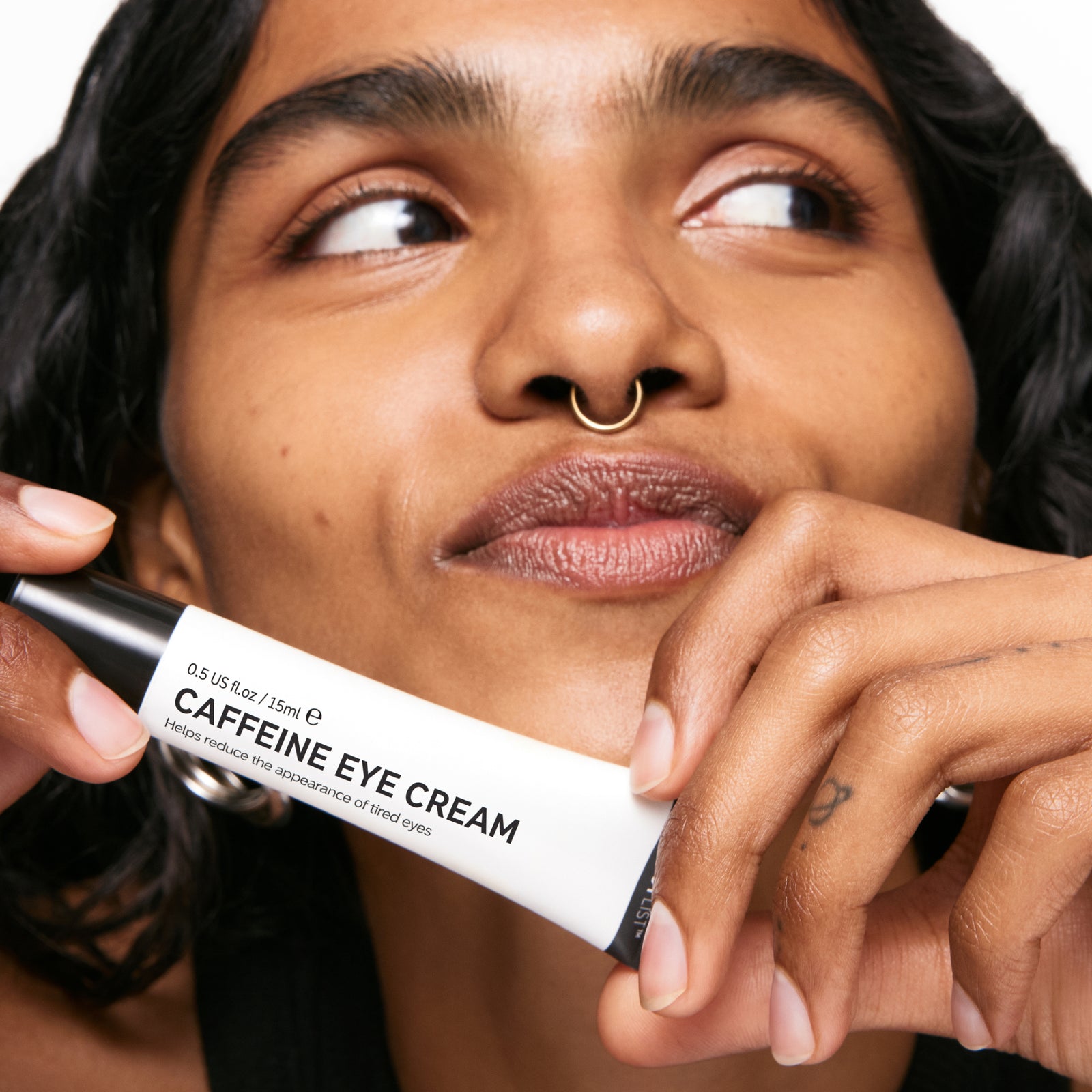 Model with caffeine eye cream