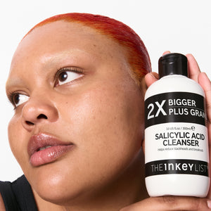 Model holding bottle of Salicylic Acid Cleanser