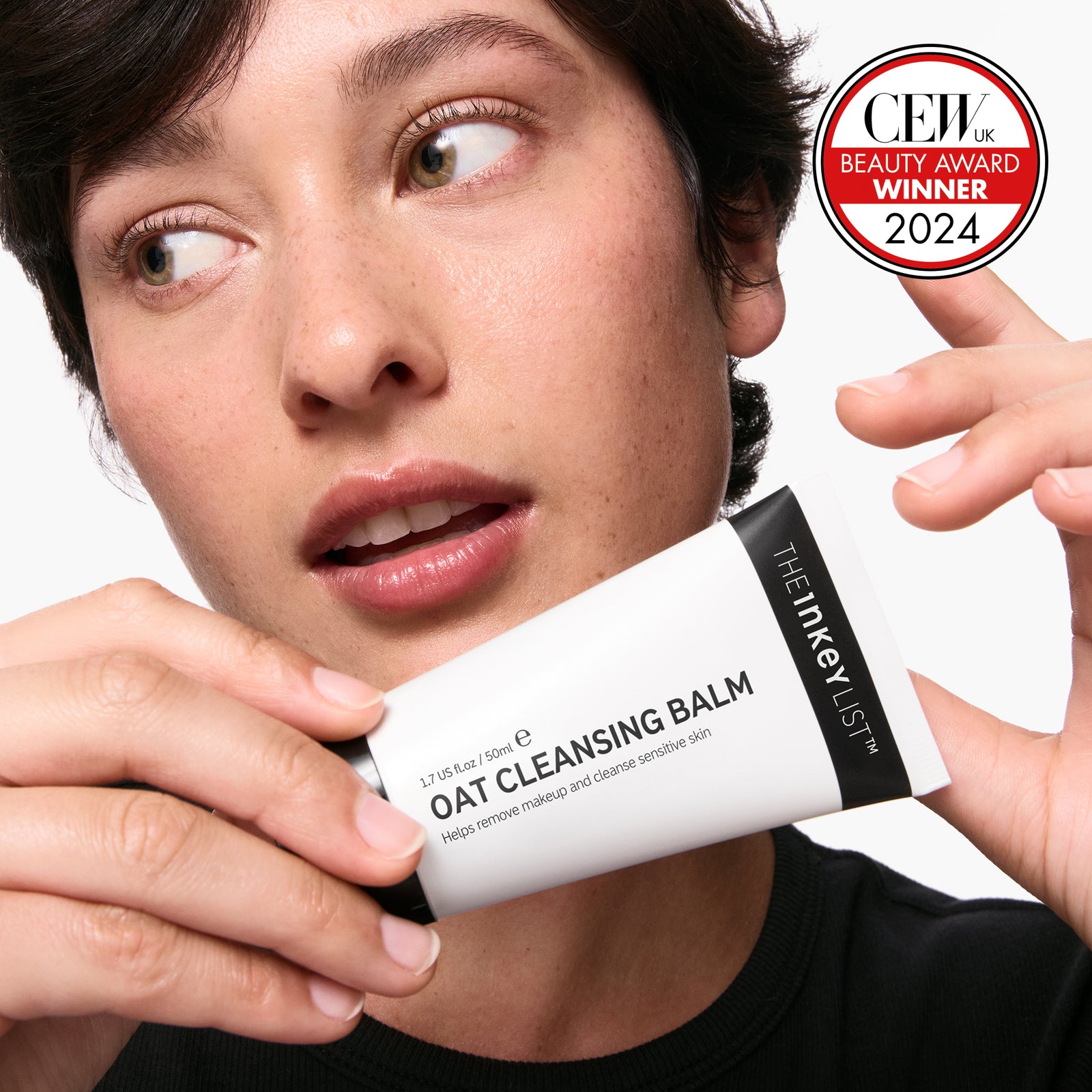 Model holding oat cleansing balm 50ml  CEW Winner 2024