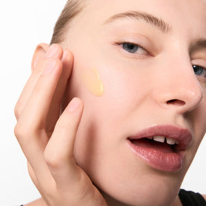 Model with retinol swatch on skin