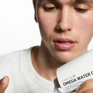 Model applying Omega Water Cream to his hand