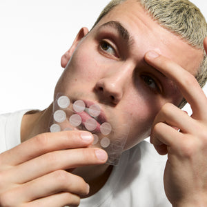 Man holding Hydrocolloid Invisible Pimple Patches