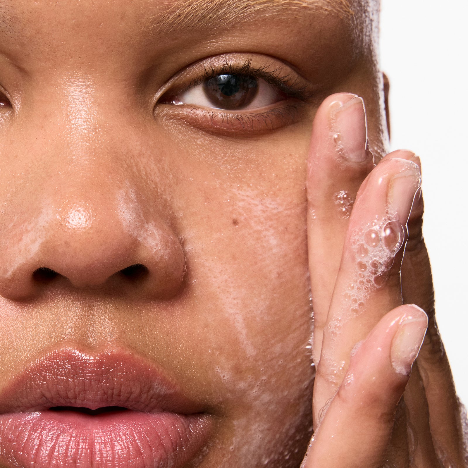 Model with cleanser on skin