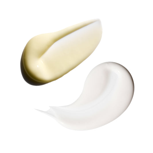 Two swatches of cream, one gold and one white, on a white background