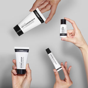 Image of models holding products in the Winter Glow Routine against a grey background