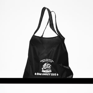 Black tote bag with 'the INKEY list' graphic on a white background