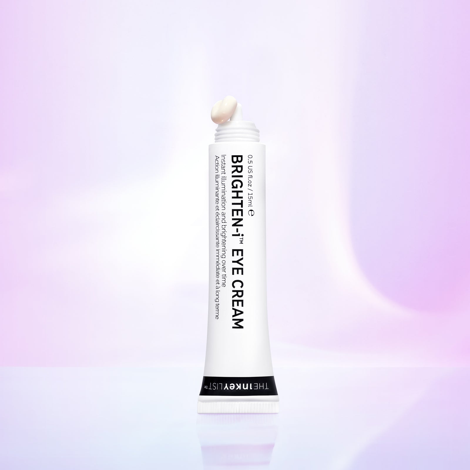 Pack shot of Brighten-I Eye Cream without the lid on pink background