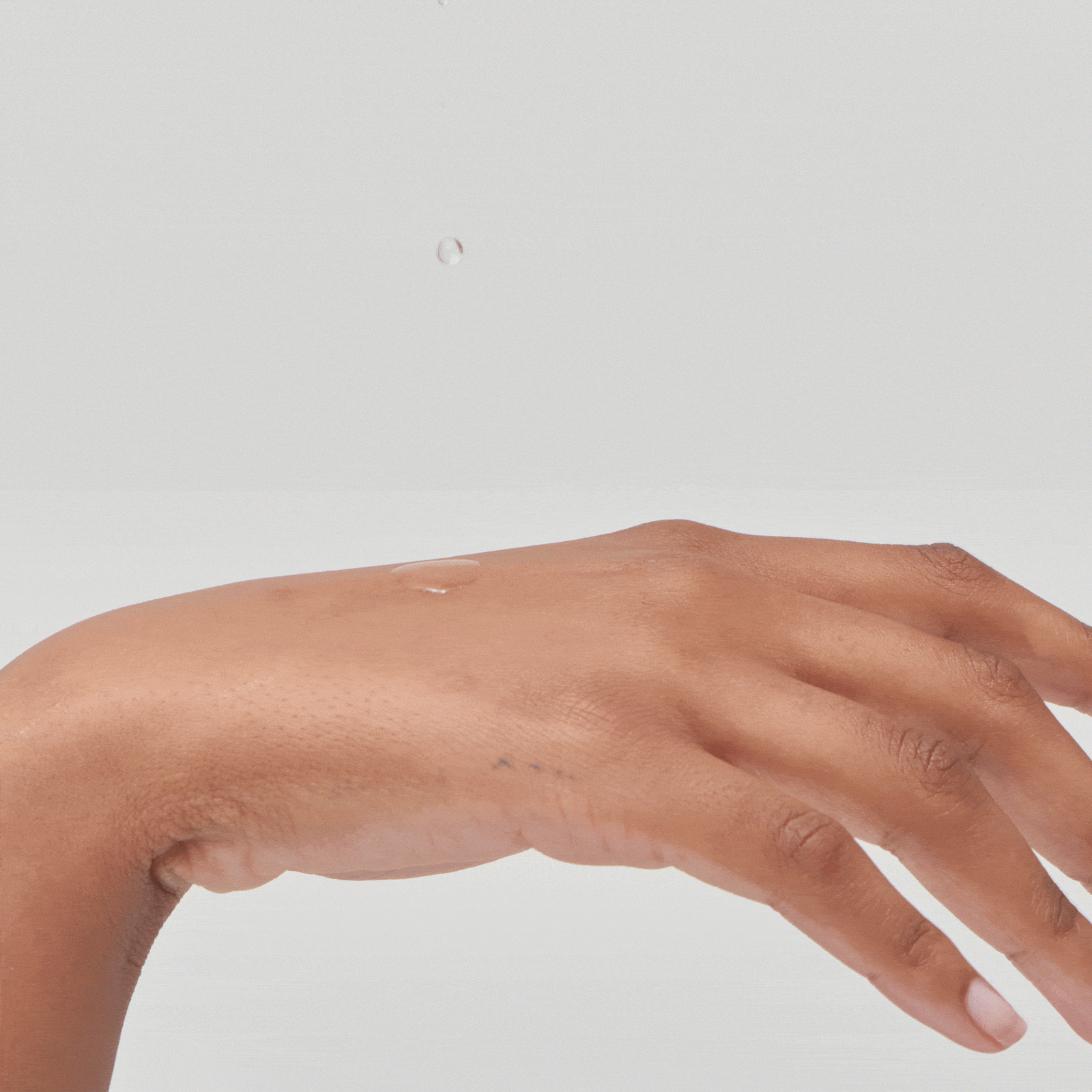 Squalane Gif product on model's hand